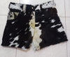 Order custom hair on cow hide shorts for men and women. These cowhide shorts feature bold fur texture in black, brown, and white cow patterns. Unique and made to order.