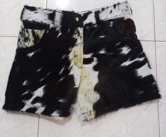 Order custom hair on cow hide shorts for men and women. These cowhide shorts feature bold fur texture in black, brown, and white cow patterns. Unique and made to order.