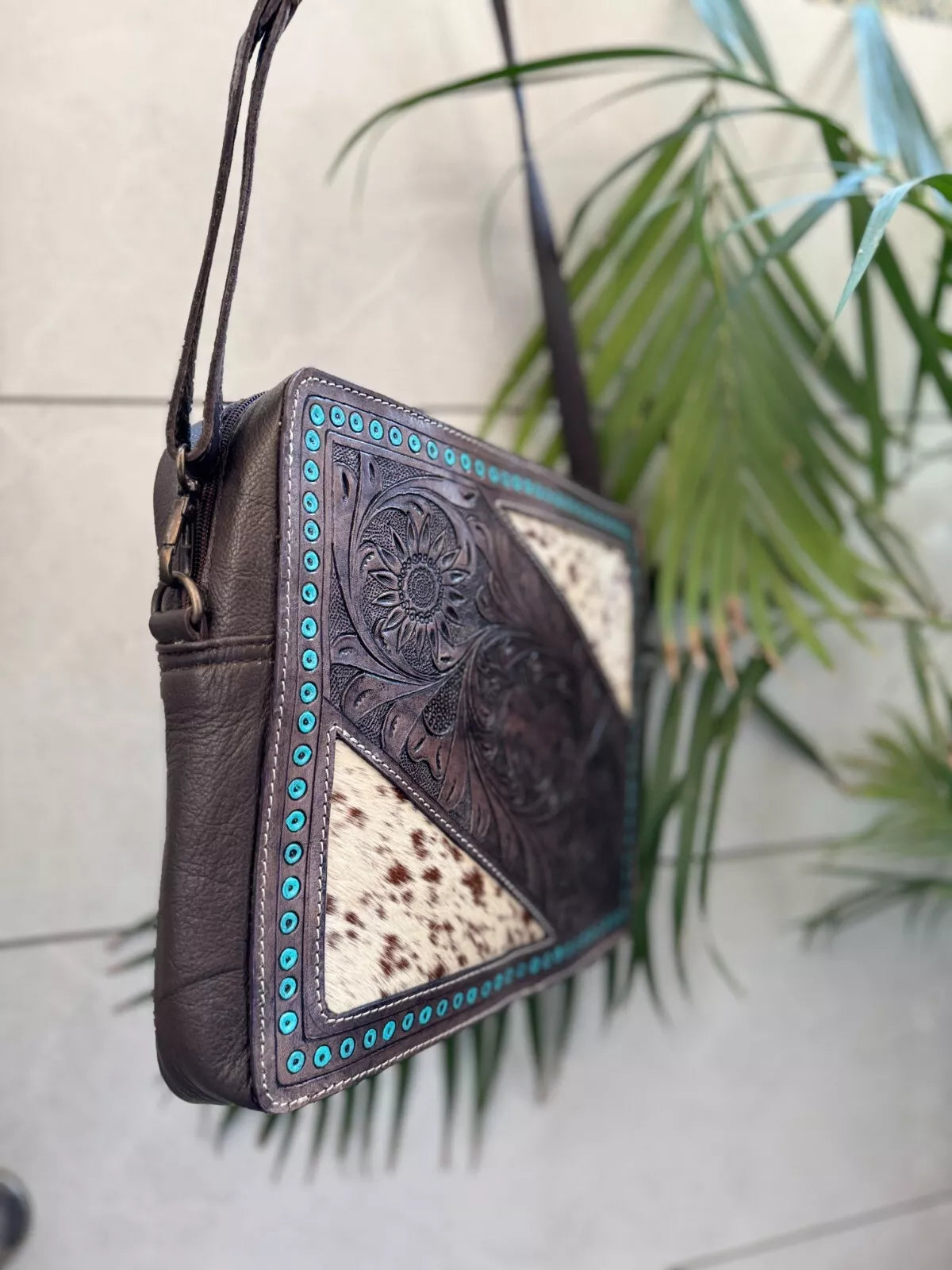 cowhide tooled leather sling bag