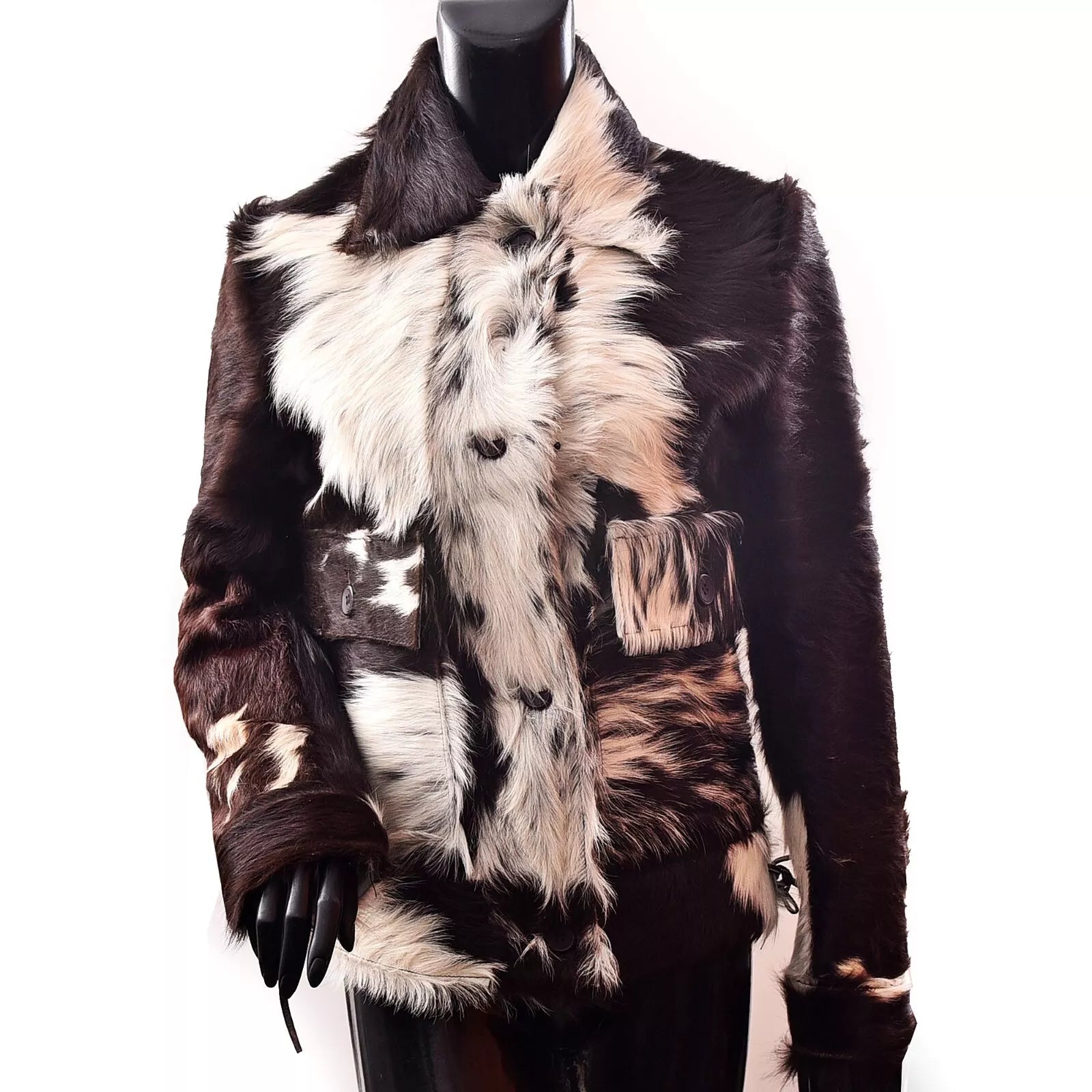 Real cowhide hair-on-hide jacket for women with button closure and natural fur. Standout cowhide coat in classic western style.

