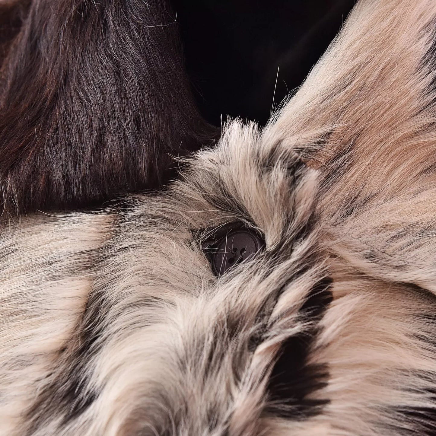 Authentic cowhide coat for women featuring natural fur texture and tricolor cow skin panels. Custom fit and handcrafted finish.

