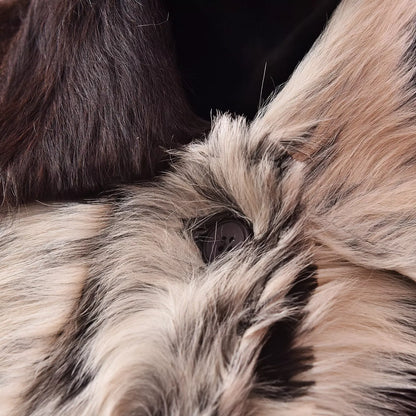 Authentic cowhide coat for women featuring natural fur texture and tricolor cow skin panels. Custom fit and handcrafted finish.

