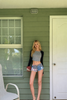 Low rise denim shorts with flag print and frayed hem