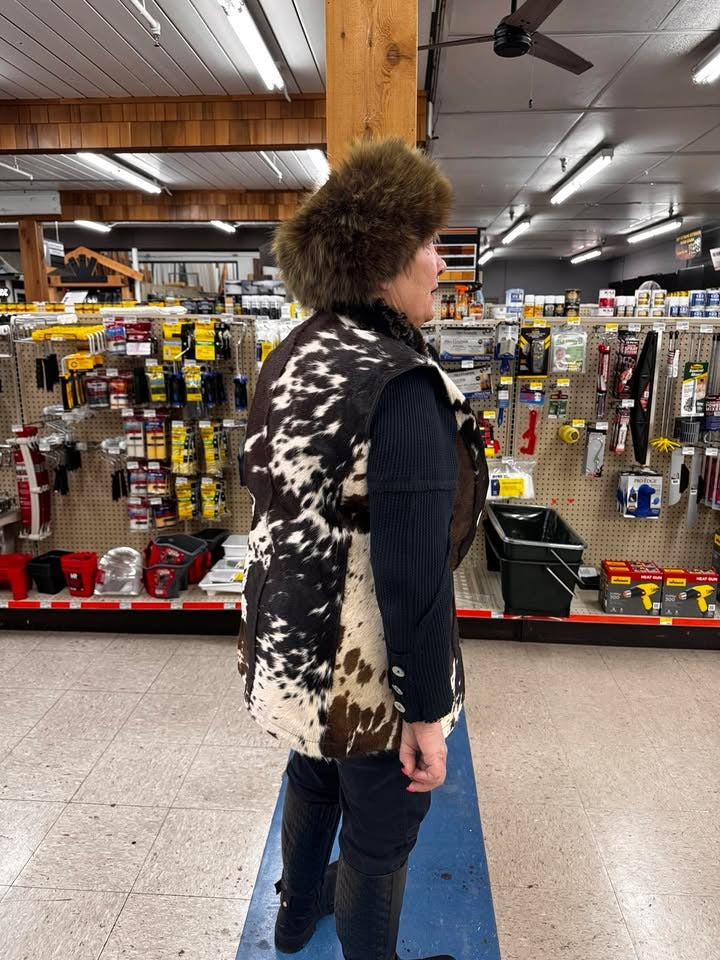 Sleeveless cowhide jacket for women made from real cow fur. Tricolor hair-on-hide vest perfect for western, ranch, or cold-weather layering.

