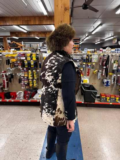 Sleeveless cowhide jacket for women made from real cow fur. Tricolor hair-on-hide vest perfect for western, ranch, or cold-weather layering.

