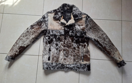Authentic hair-on cowhide jacket made with black, brown, and white cow skin. Perfect western outerwear for men who wear cowboy style daily.