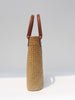 Natural straw beach tote with brown leather handles