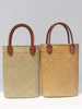 Natural straw beach tote with brown leather handles