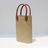 Natural straw beach tote with brown leather handles Light