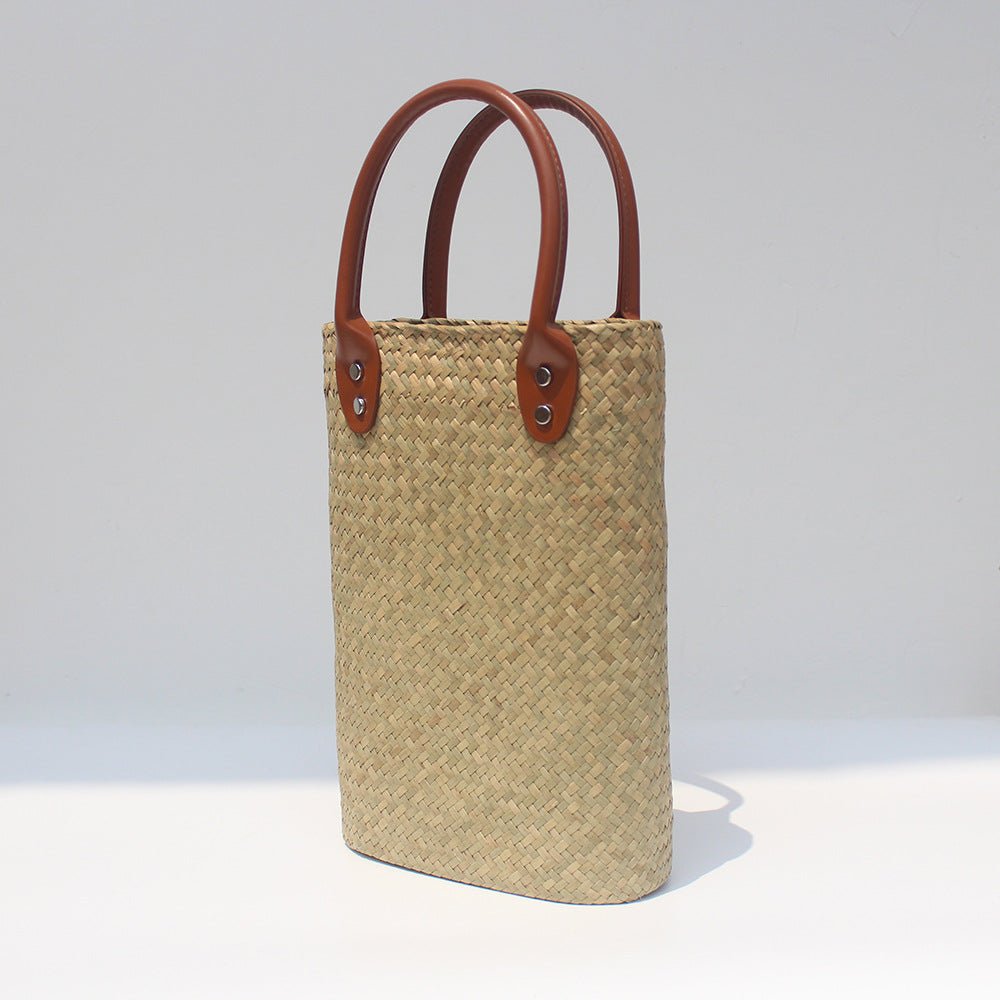 Natural straw beach tote with brown leather handles Light