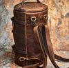 Assortment of stylish leather backpacks with sleek designs, adjustable straps, and elegant finishes, arranged on a wooden surface.