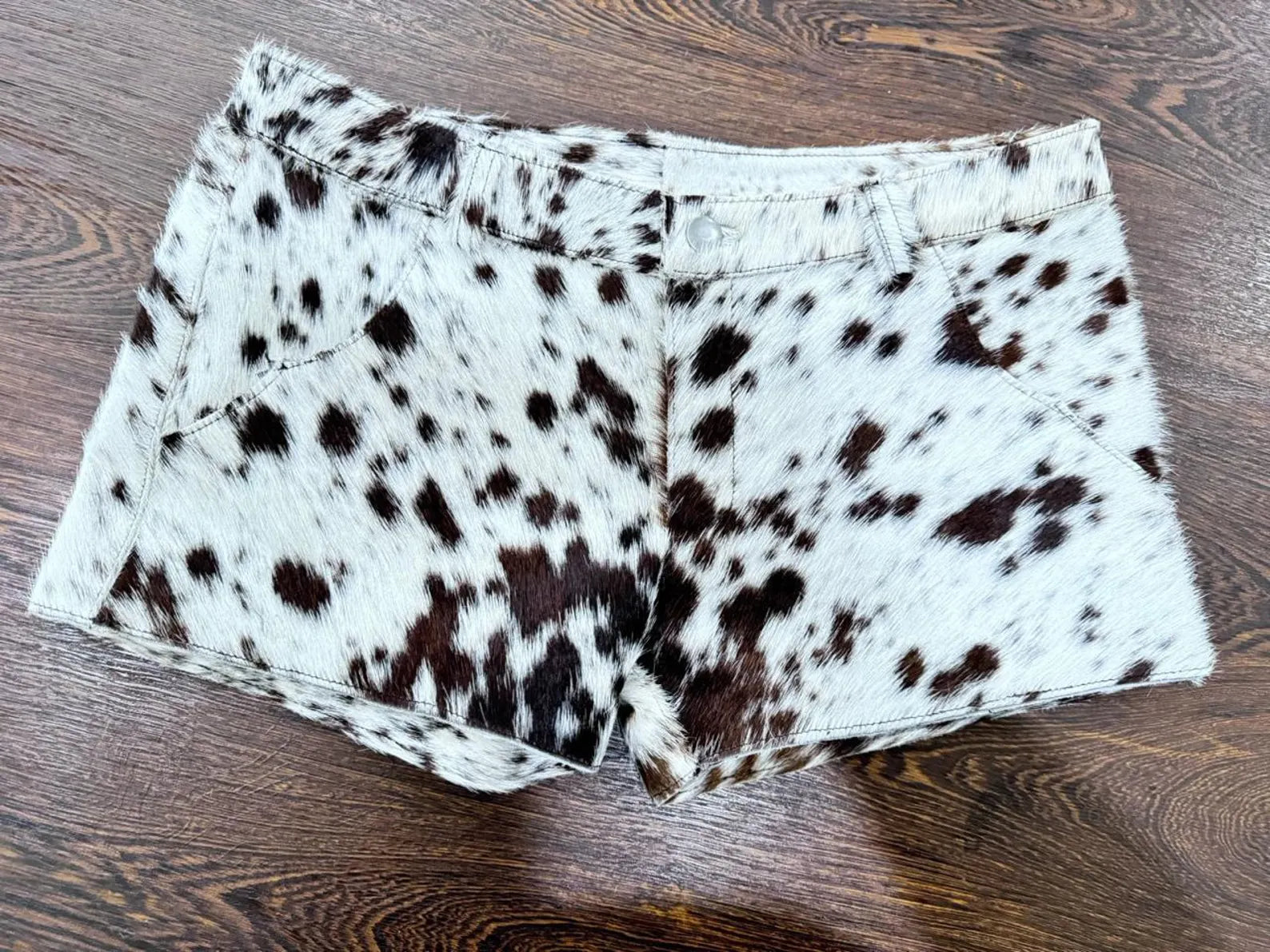 Cow print shorts made for rodeo events, western get-togethers, and horse racing. A bold cowgirl look with a southern twist!