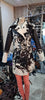 Stand out in a women cowhide trench coat with natural spotted hide pattern. Real cowhide leather jacket designed for bold winter styling.

