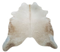 Beige palomino white belly cowhide rugs have become the trademark of modern mixed with natural, from layering to western style.