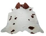 This cowhide rug will fill up your room in a unique and natural touch, the beautiful brown white will match the neutral sofa and layering living room