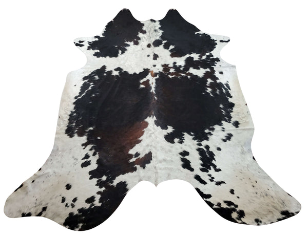A stunning and exotic dark brown speckled cowhide rug selected for a unique pattern, very soft and smooth to walk on.