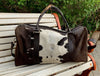 Hit the road in style with a chic cow fur weekender bag, a symbol of sophistication and adventure.