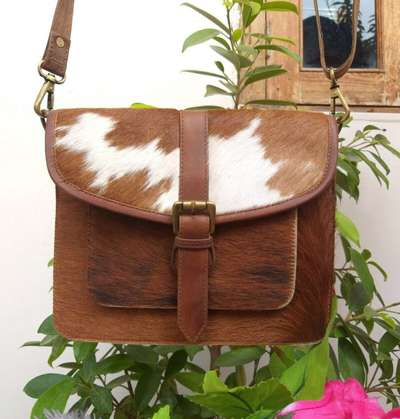 This stylish western cowhide crossbody bag is the perfect accessory for any occasion, combining trendy style with quality craftsmanship.