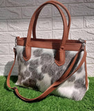 This exotic real cowhide tote bag is perfect for any fashionista! It's luxurious, unique, and stylish - perfect for the modern woman.