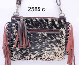 This luxurious exotic cowhide crossbody bag for women is the perfect accessory for a night out.