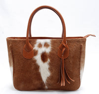With so many different styles and materials available, it can be tough to know which cowhide bag is right for you. If you're looking for a stylish and durable option, consider a cowhide tote bag.