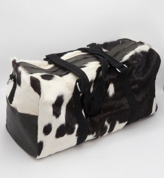 If you're looking for a stylish and practical cowhide luggage bag that's easy to carry, look no further than the women's duffle bag from black and white cowhide.