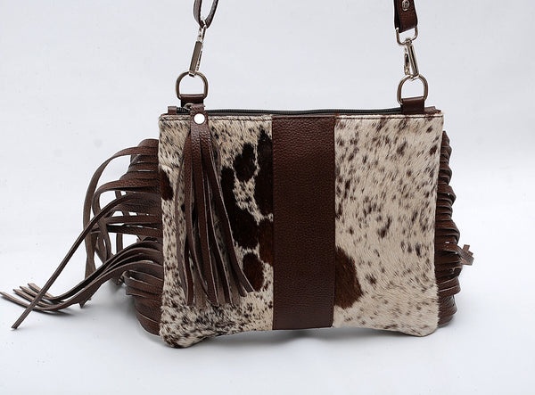 This real cowhide crossbody purse with fringes is the perfect bag for those who want to dress up their outfits while still being able to move around easily and comfortably