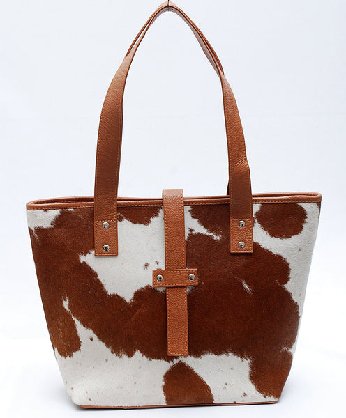 A quality cowhide bucket bag is a timeless investment piece that every woman needs in her wardrobe, perfect for busy ladies who need an everyday bag.