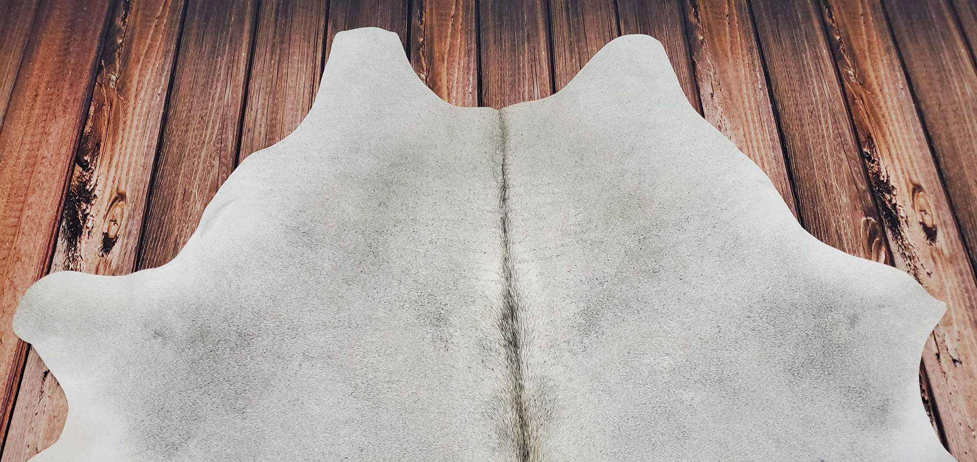 The grey colour of the cowhide also makes it ideal for use in darker spaces, as it will help to reflect light and brighten up the room.