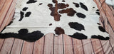 This genuine cowhide rug is enticing. It's perfect for a country-style kitchen area. It's all-natural and allergen-free, so dogs love it and free shipping all over the USA.