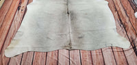The cowhide rug is attractive but matches any farmhouse, It fits well on any oak floor.