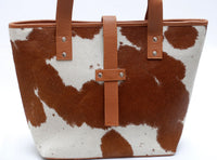 A good quality cowhide bucket bag will last you for years. If you take care of it, it will only look better with age. This makes it a wise investment that will never go out of style.