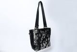 One of a kind handcrafted cowhide ladies bag in messenger style perfect for country styling or even office wear, from speckled black to brown white
