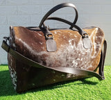 Simplify your packing with our cowhide overnight bag, resilient and spacious enough for your travel essentials.