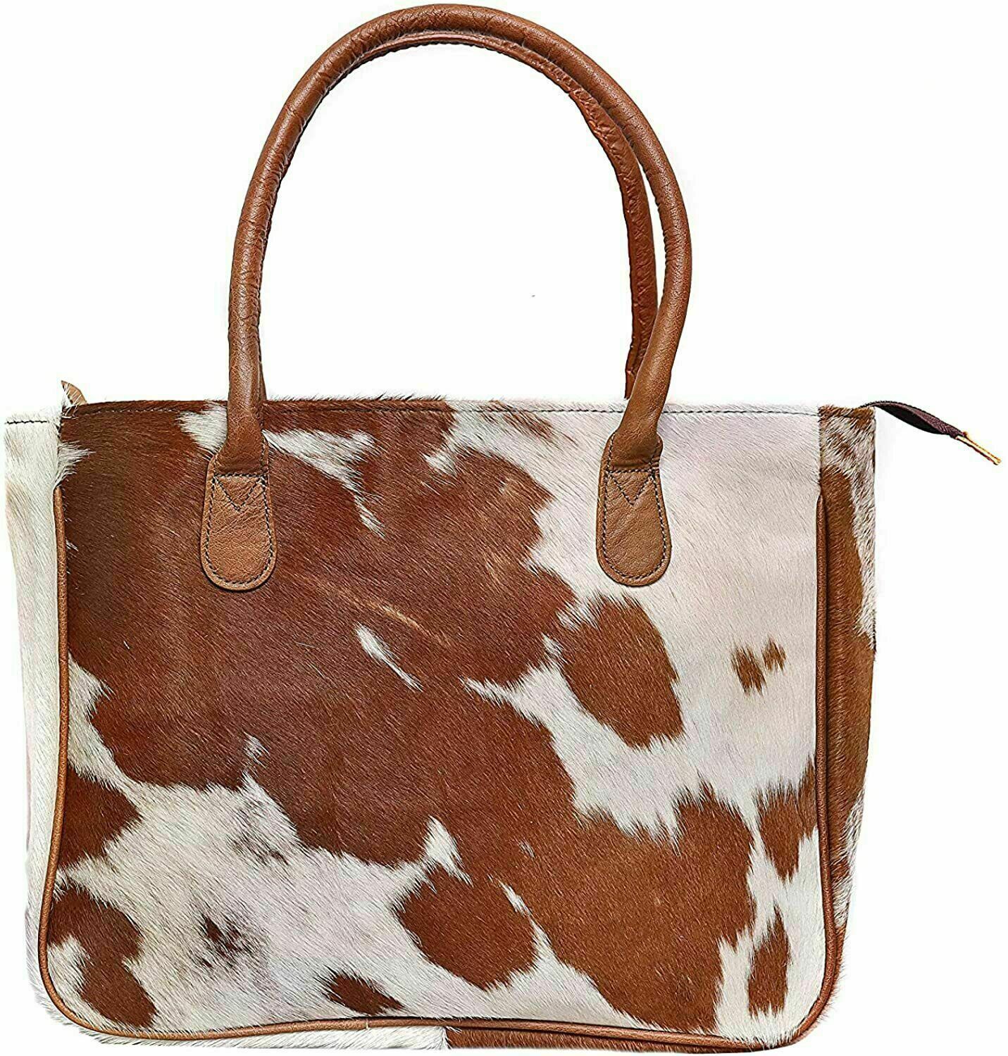 This stylish cowhide handbag for women is perfect for carrying personal items, shopping, and work gear.