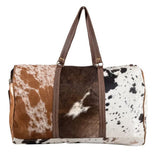 Cowhide patchwork duffel bags are the perfect choice for those who need an elegant and stylish way to travel.