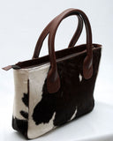Leather cowhide bags in tote styles come in all shapes and sizes, ranging from roomy totes that can accommodate multiple items to sleek shoulder bags ideal for taking out on the town. 
