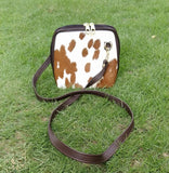 Stylish and practical, this cowhide crossbody bag is a must-have for any woman on the go. This season, cowhide is the material of choice for stylish women everywhere. 