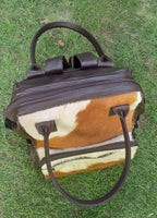 Beautiful leather winter bag you can wear this cowhide diaper bag with so many looks. Beautifully made leather and cowhide diaper bag for a sensational price.