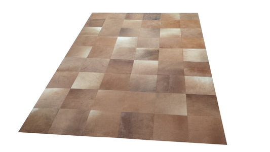 Brown cowhide patchwork rug