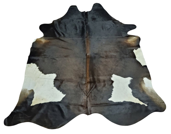 Dark brown, some black and white are most underrated tricolor cowhide rug pattern, so when nature mixes these a very special shade is created.