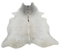 This is a one of a kind cowhide rug in a unique grey cowhide rug that will be great as a gift for friends and family, lays flat on wooden floor. 