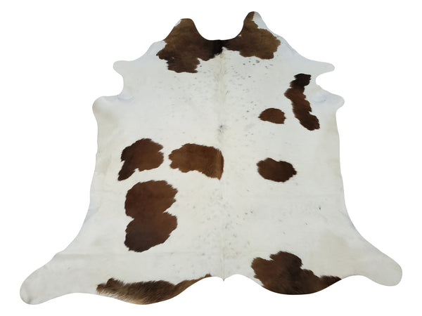 Discover this unique natural cowhide rug, featuring a unique and stylish brown and white color combination. Perfect for adding texture and warmth to any space!