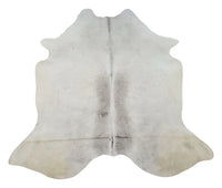 A new grey cowhide rug will clear away the way for a crisp and cozy living room