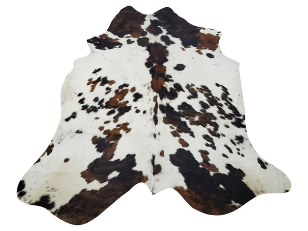 Large cowhide rug tricolor speckled is great for home decor it can nicely go a little under a coffee table, a small pouf or another type of furniture