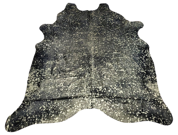 A new metallic cowhide rug in a guest room is what is needed and mix with silver and black. 
