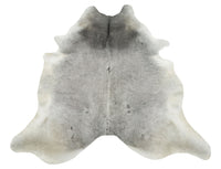 Grey cowhide rugs are made from the hide of a cow, which is then  tanned and treated to create a beautiful and durable rug. They're perfect for high-traffic areas because they're so tough and easy to clean. Just vacuum regularly and spot-clean spills as they happen.