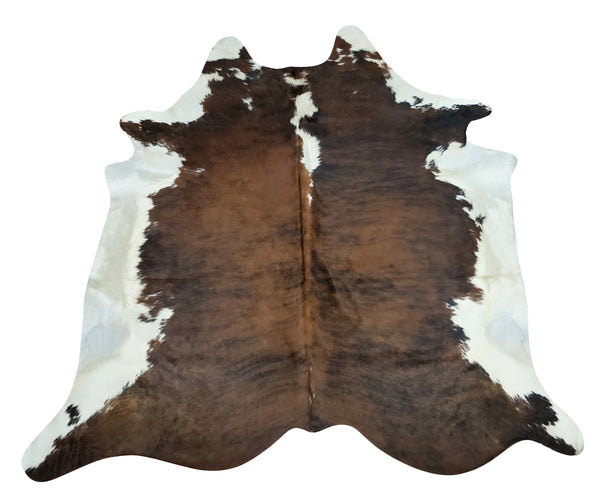This is the most gorgeous large cow skin rug you will be pleased with the natural tricolor pattern a great addition to your home office western studio