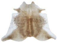 Wondering what style is cowhide rug in interior, we have gorgeous champagne cowhide perfect for under the bed or living room sofa, real and natural.