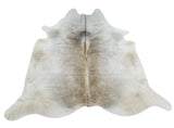 A grey cowhide rug prettier than pictured, soft lighter colors great for upholstery, it will blend beautifully with taupe white furniture and free shipping.
